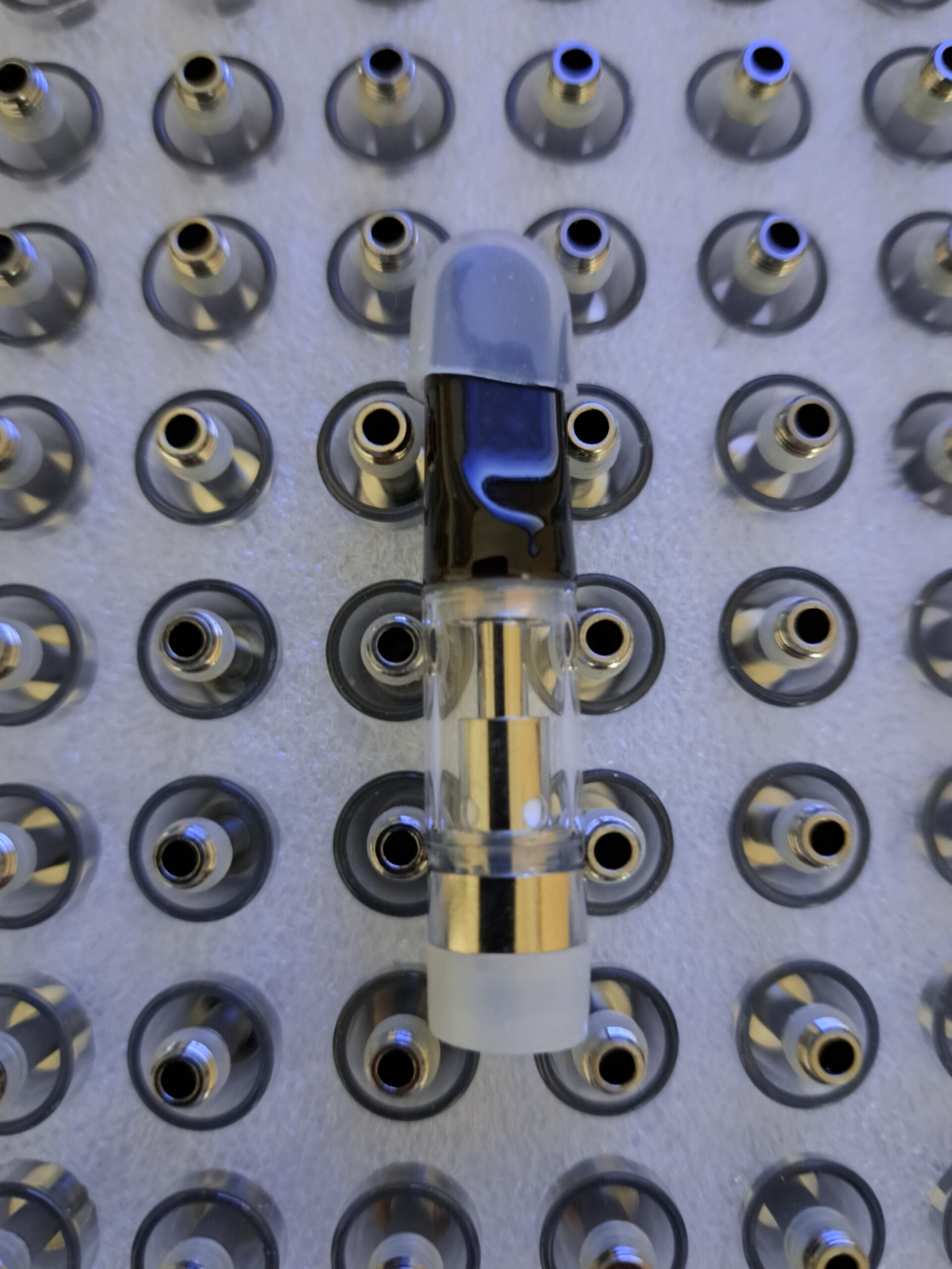 A V4 - Black Tip - 0.5ml e-liquid bottle among others.