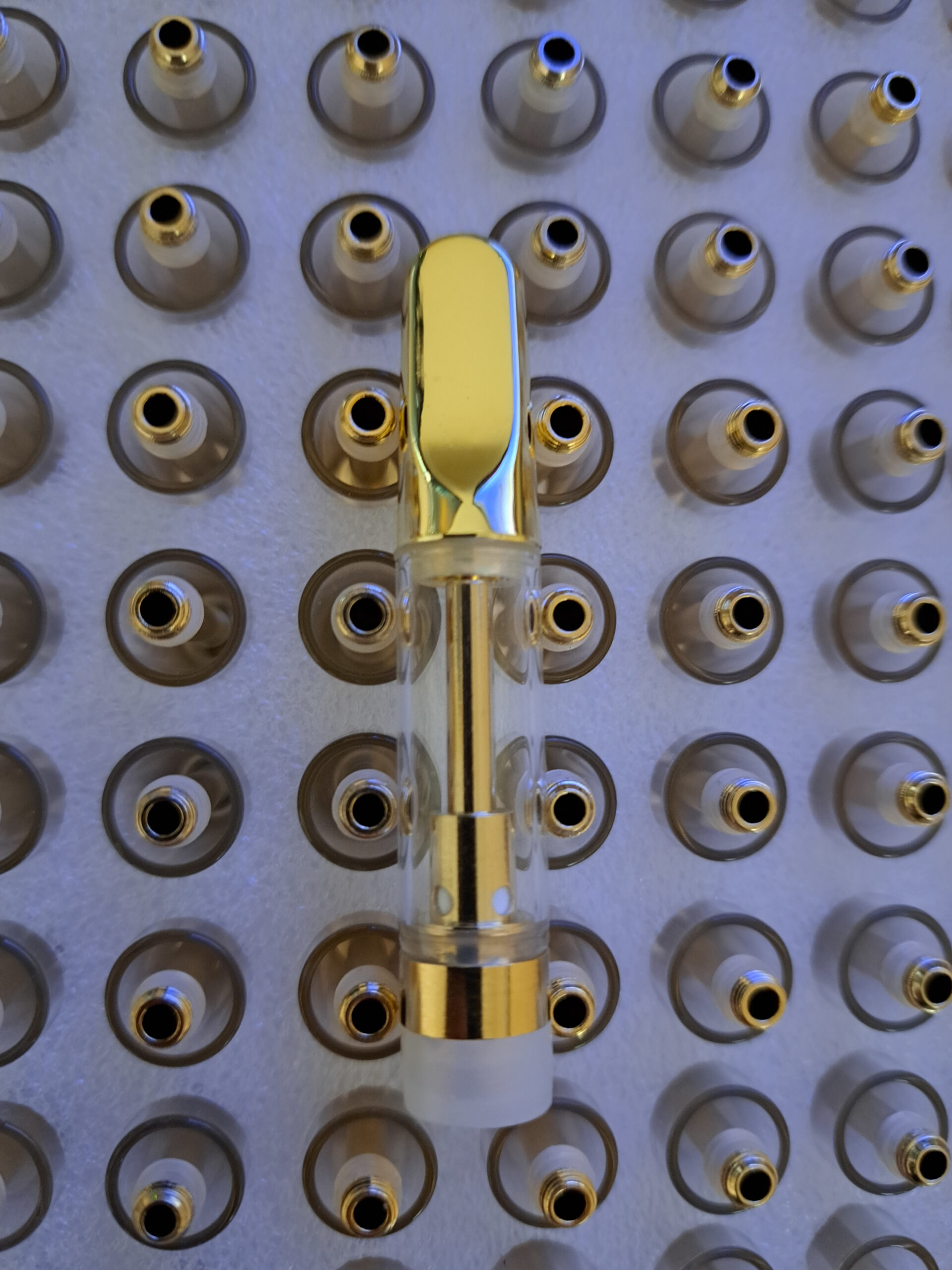 A group of Gold - 1ml bottles.
