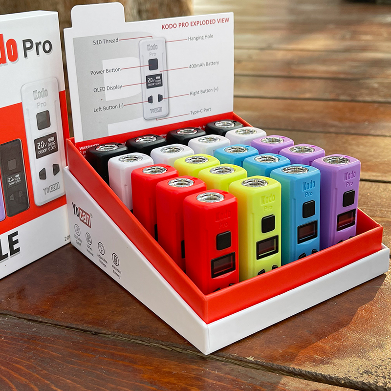 A box containing a variety of different colored e-cigs with the Yocan Kodo Pro Battery included.