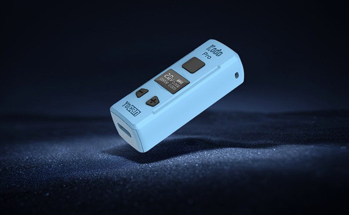 A blue Yocan Kodo Pro Battery sitting on a dark surface.