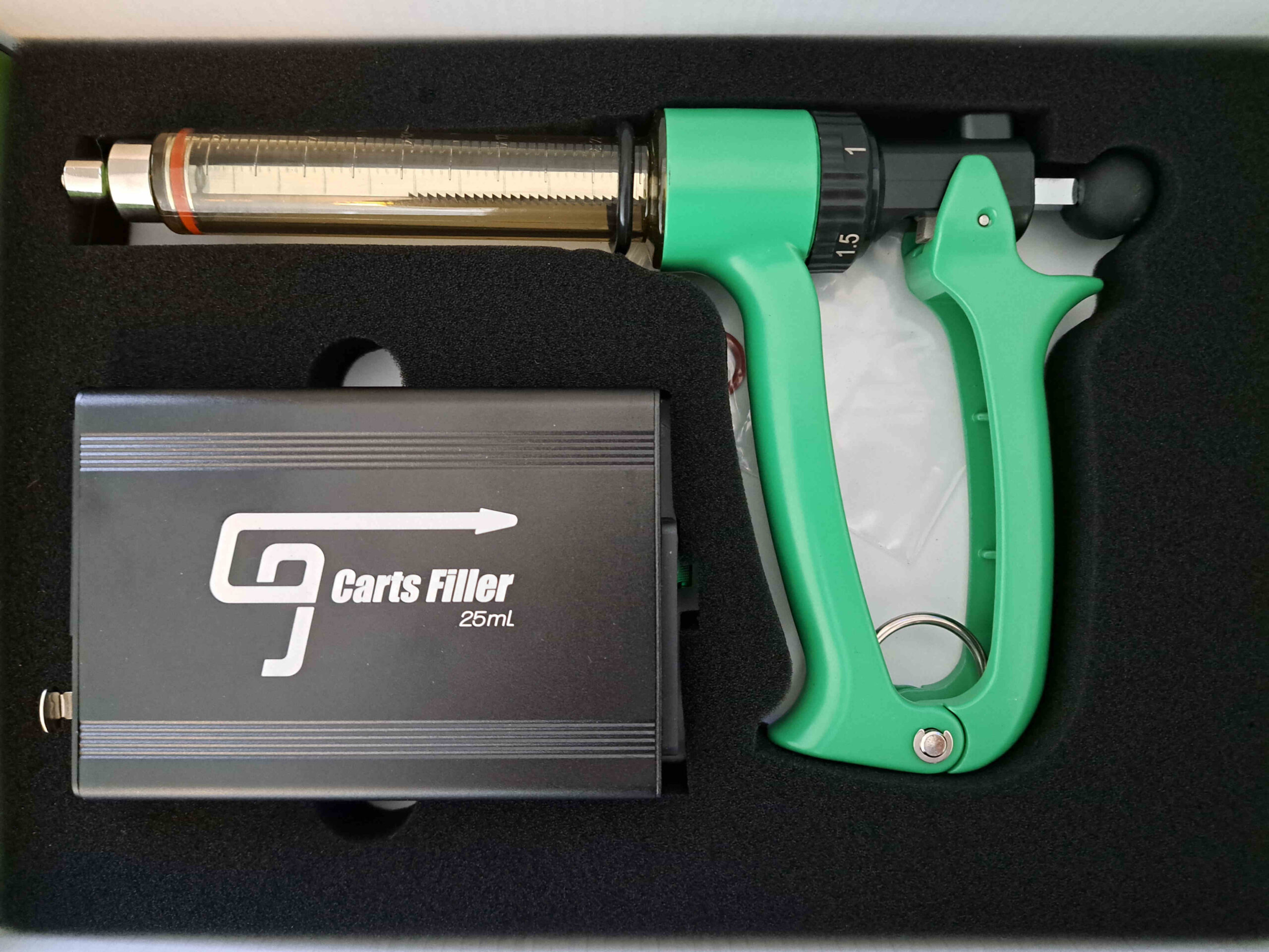 A grey gun with a charger.